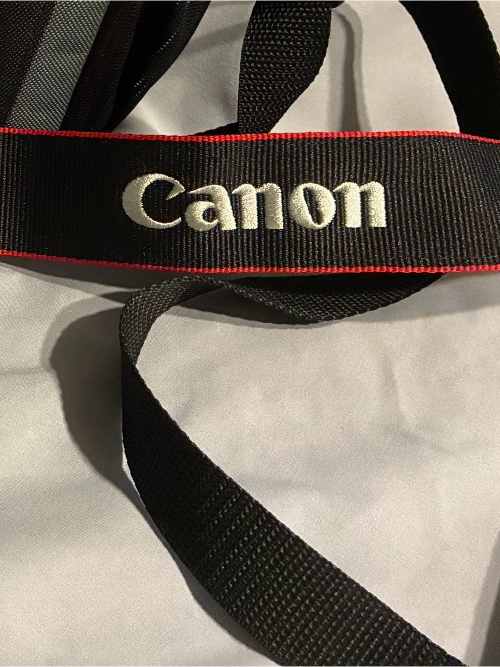Canon Black Camera Neck Strap with Red Trim and White Logo